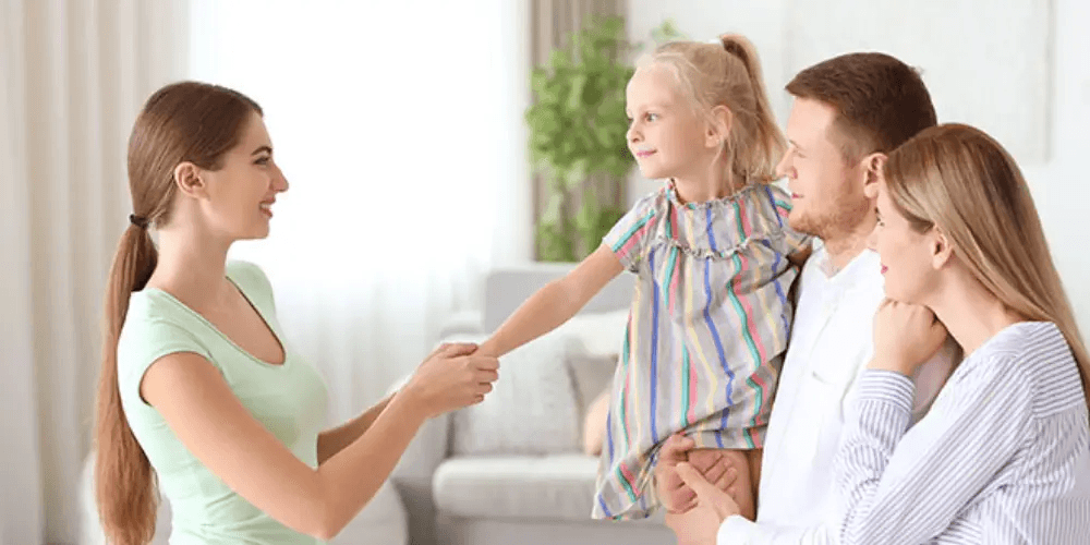 Parent handoff moment at the front door