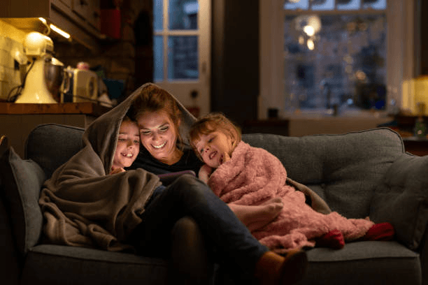Sitter reading with a child